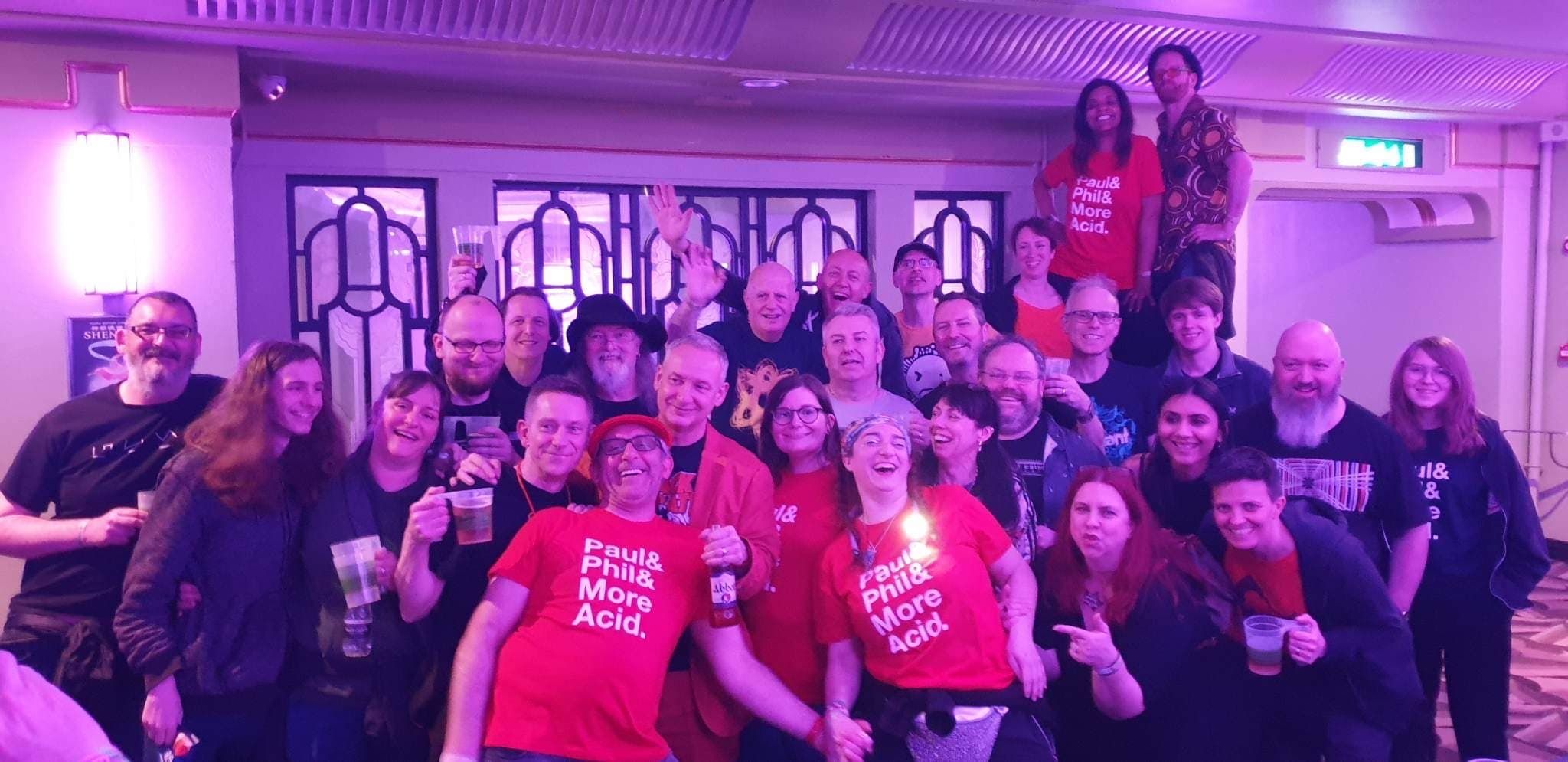 a huge group of Orbital fans and Paul Hartnoll from Orbital. Some of whom are wearing the t-shirt