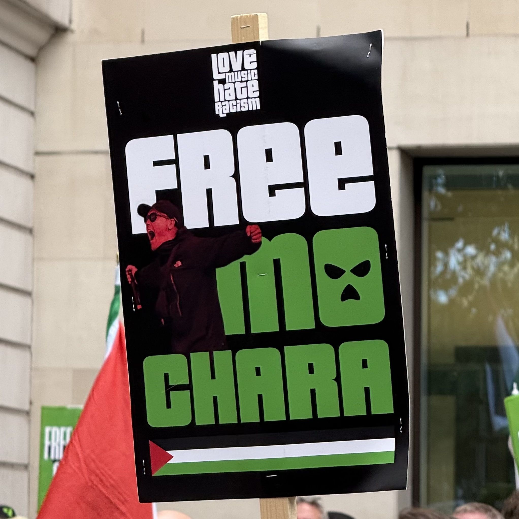 A love music hate racism banner which reads Free Mo Chara